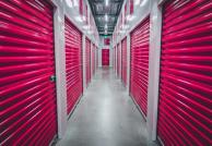 Pink storage doors in a hallway.